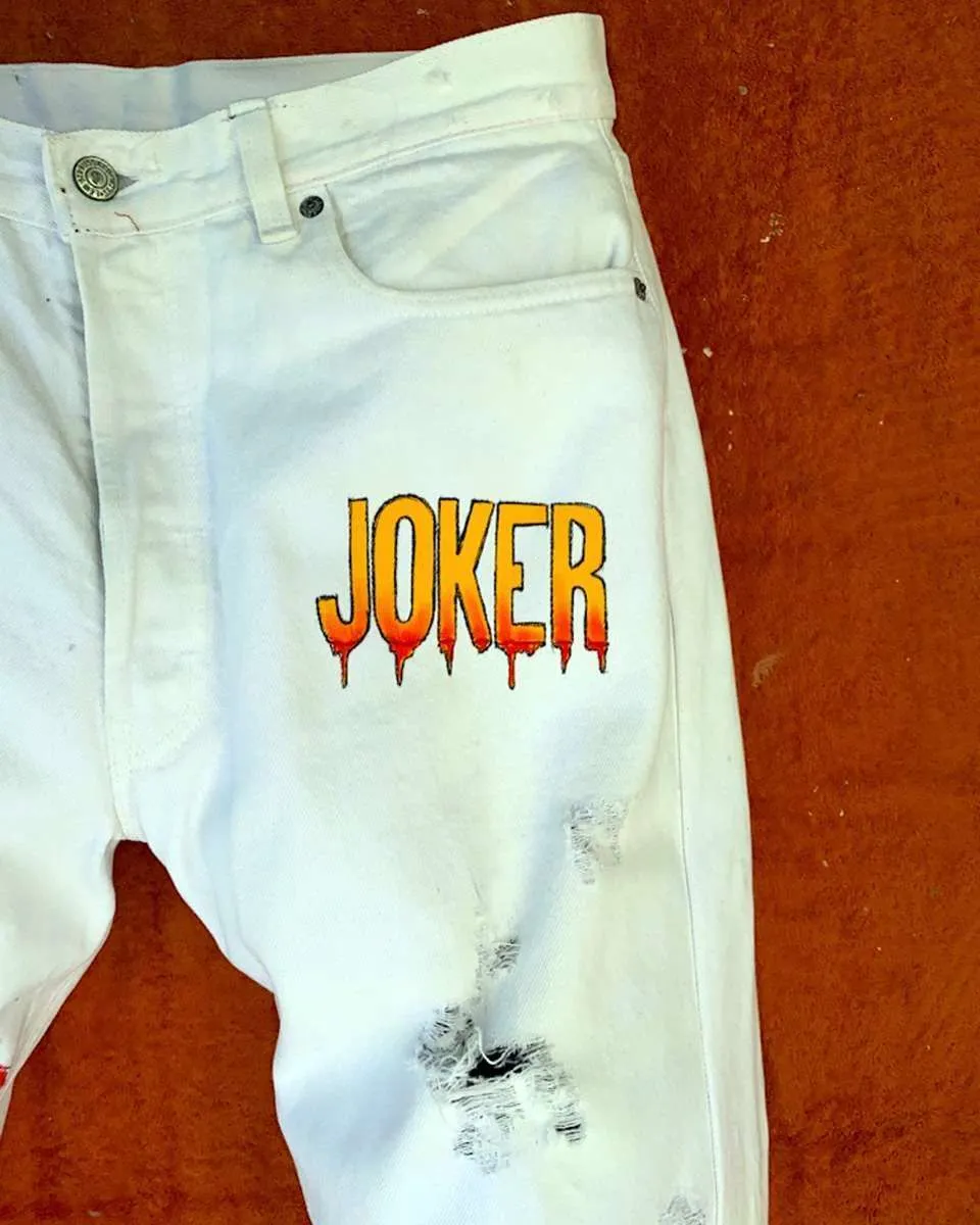 Never Say Never Joker Phoenix jeans bianchi dipinti a mano